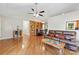 Expansive living area showcases hardwood floors, built-in shelving, and a vaulted ceiling for a spacious feel at 109 Wren Ln, Mooresville, NC 28117