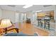 Relaxing living room with wood floors flowing into the kitchen, creating a inviting space at 109 Wren Ln, Mooresville, NC 28117