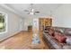 Inviting living room featuring hardwood floors, a vaulted ceiling, and ample natural light creates a warm atmosphere at 109 Wren Ln, Mooresville, NC 28117