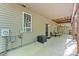 Covered patio features outdoor seating, an electrical box and an air conditioning unit at 109 Wren Ln, Mooresville, NC 28117