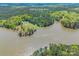 Stunning aerial view of waterfront home with a private pool on a wooded lot at 1308 Twin Oaks Dr, Chester, SC 29706