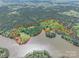 Aerial view of property with property lines, pool, home, lush trees and lake frontage at 1308 Twin Oaks Dr, Chester, SC 29706