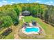 Aerial view of a large house, in-ground pool, gazebo, and lake at 1308 Twin Oaks Dr, Chester, SC 29706