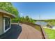 Spacious wooden deck with lake view and a glimpse of the pool area with cabana at 1308 Twin Oaks Dr, Chester, SC 29706