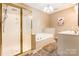 Neutral bathroom with a tiled floor, shower, bathtub, and double sink vanity with white countertops at 1308 Twin Oaks Dr, Chester, SC 29706