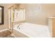 Clean bathroom featuring a white bathtub and a glass-enclosed shower with gold trim at 1308 Twin Oaks Dr, Chester, SC 29706