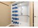 Bathroom featuring a accessible shower with blue and white striped shower curtain at 1308 Twin Oaks Dr, Chester, SC 29706
