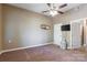 Neutral bedroom featuring a ceiling fan, carpet flooring, and an adjacent bathroom entrance at 1308 Twin Oaks Dr, Chester, SC 29706