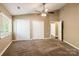 Bedroom with brown carpet, neutral walls, and white closets providing ample storage space at 1308 Twin Oaks Dr, Chester, SC 29706