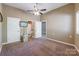Neutral bedroom featuring a ceiling fan, carpet flooring, and adjacent bathroom and closet entrances at 1308 Twin Oaks Dr, Chester, SC 29706