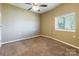 Cozy bedroom features neutral paint, a ceiling fan, and a window that provides natural light at 1308 Twin Oaks Dr, Chester, SC 29706
