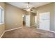 Neutral bedroom offers a ceiling fan and access to an ensuite bathroom and walk-in closet at 1308 Twin Oaks Dr, Chester, SC 29706