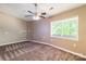 Bedroom featuring neutral walls, brown carpet, and a bright window at 1308 Twin Oaks Dr, Chester, SC 29706