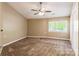 Bedroom with neutral walls, brown carpet, a ceiling fan, and a window view of greenery at 1308 Twin Oaks Dr, Chester, SC 29706