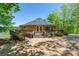 Unique round home featuring a wraparound deck perfect for enjoying serene natural surroundings at 1308 Twin Oaks Dr, Chester, SC 29706