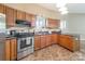 Well-equipped kitchen with stainless steel appliances, ample cabinet space, and efficient layout for cooking convenience at 1308 Twin Oaks Dr, Chester, SC 29706