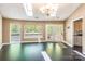 Bright living room featuring hardwood floors, skylights, and large windows showcasing serene outdoor views at 1308 Twin Oaks Dr, Chester, SC 29706