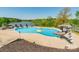 Lake view of private in-ground pool with a slide and yellow float at 1308 Twin Oaks Dr, Chester, SC 29706