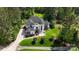Luxury home with lush greenery offers privacy and serene landscaping on a vast lot at 133 Crooked Branch Way, Troutman, NC 28166