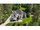 Expansive home on a sprawling lot featuring impeccable landscaping and a grand entrance at 133 Crooked Branch Way, Troutman, NC 28166
