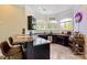 This bar features a granite countertop, wood cabinets, stainless dishwasher and three large windows at 133 Crooked Branch Way, Troutman, NC 28166