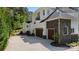 Stately home showcases multi-car garage, stone accents, lush landscaping, and pristine curb appeal at 133 Crooked Branch Way, Troutman, NC 28166