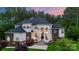 Stately home featuring a beautiful front facade, well manicured lawn, and tasteful landscaping at 133 Crooked Branch Way, Troutman, NC 28166