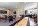 Game room featuring a shuffleboard table, television, and wet bar at 133 Crooked Branch Way, Troutman, NC 28166