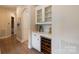 Hallway features a built-in wine cooler and glassware cabinet at 133 Crooked Branch Way, Troutman, NC 28166