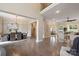 Spacious open-concept living area, dining area, and staircase with hardwood floors, creating an inviting atmosphere at 133 Crooked Branch Way, Troutman, NC 28166