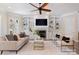 Stylish living room features built-in shelving, a cozy fireplace, and comfortable seating, perfect for relaxation at 133 Crooked Branch Way, Troutman, NC 28166
