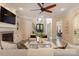 Open concept living room featuring fireplace, and view of the entrance and dining area at 133 Crooked Branch Way, Troutman, NC 28166