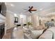 Bright living room boasts hardwood floors, fireplace, and open access to the kitchen and grand entrance at 133 Crooked Branch Way, Troutman, NC 28166