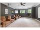Home theater room featuring plush seating, a projector, and a large screen at 133 Crooked Branch Way, Troutman, NC 28166