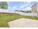 Fenced backyard with a small concrete patio and graded backyard at 13514 Tartarian Ct, Charlotte, NC 28215
