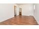 Bedroom with hardwood floors and doors leading to the bathroom and another room at 13514 Tartarian Ct, Charlotte, NC 28215