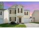 Charming two-story home with a well-maintained lawn and attached garage, perfect for suburban living at 13514 Tartarian Ct, Charlotte, NC 28215