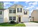 Charming two-story home with a well-maintained lawn and attached garage, perfect for suburban living at 13514 Tartarian Ct, Charlotte, NC 28215