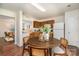 Charming kitchen with wood cabinets, white appliances, and adjacent dining area at 13514 Tartarian Ct, Charlotte, NC 28215