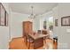Elegant dining room with natural light, featuring a wooden table for gatherings and special occasions at 140 Parkview St, Davidson, NC 28036