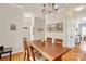 Stylish dining room with a wooden table and modern lighting, creating a welcoming space for meals at 140 Parkview St, Davidson, NC 28036