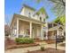 Inviting two-story home boasts a spacious front porch, perfect for relaxing and enjoying the neighborhood at 140 Parkview St, Davidson, NC 28036