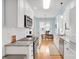 Bright kitchen features white cabinets, stainless steel appliances, and granite countertops at 140 Parkview St, Davidson, NC 28036