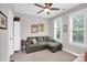 Comfortable living room features lots of natural light and plenty of seating at 140 Parkview St, Davidson, NC 28036