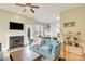Stylish living room featuring a fireplace and open floor plan, perfect for modern living and entertaining guests at 140 Parkview St, Davidson, NC 28036