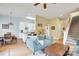Open-concept living room with hardwood floors, seamlessly connecting the living space and dining area at 140 Parkview St, Davidson, NC 28036