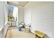 Cozy side porch with seating, offering a tranquil outdoor retreat with a view of the yard at 140 Parkview St, Davidson, NC 28036