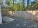 Backyard featuring a tall privacy fence, gray gravel and a paved patio area at 1401 Anderson St, Charlotte, NC 28205