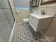 Bathroom featuring modern vanity, stylish floors, sleek fixtures, and shower with glass doors at 1401 Anderson St, Charlotte, NC 28205