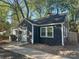 Charming, well-maintained single-story home with a concrete walkway and a dark gray exterior at 1401 Anderson St, Charlotte, NC 28205
